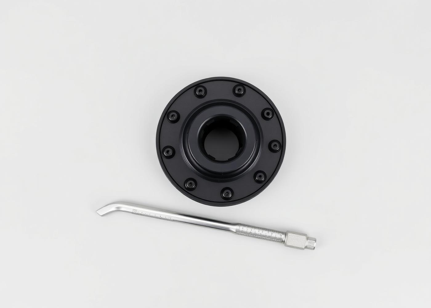 Center-lock hub socket and calibrated torque wrench on a clean workbench